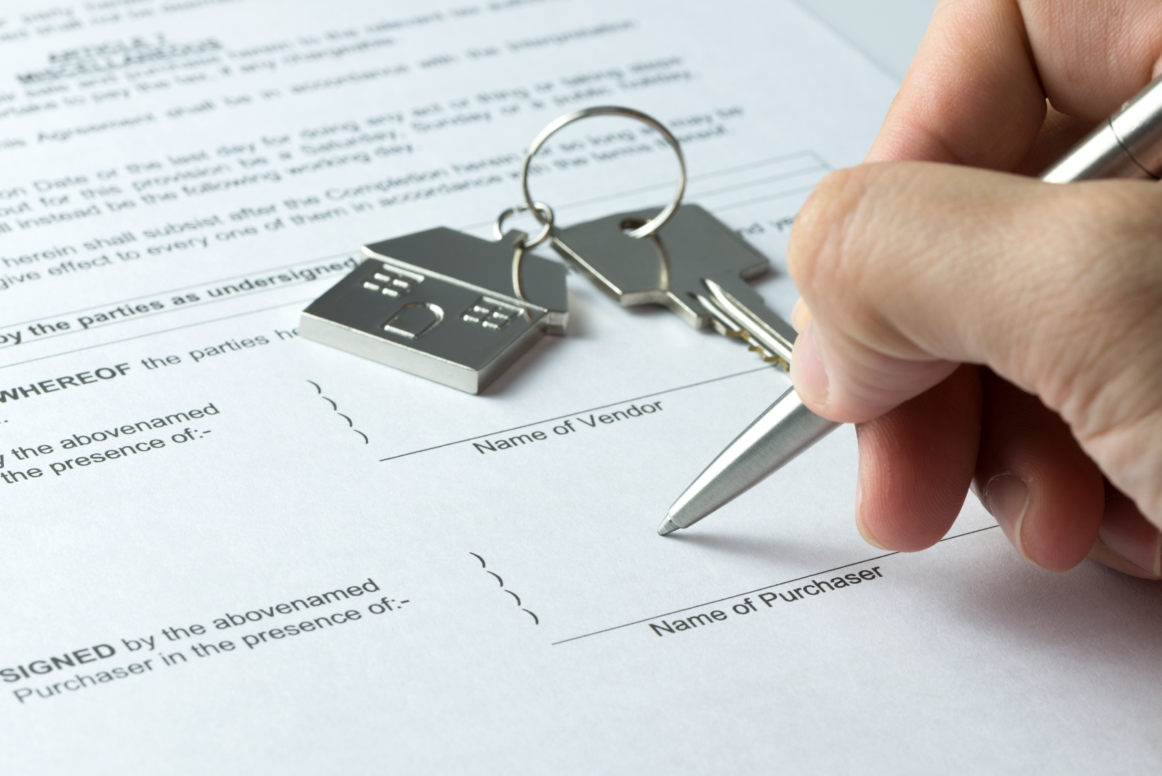 Signing-Real-Estate-Document-with-Keys-to-Property